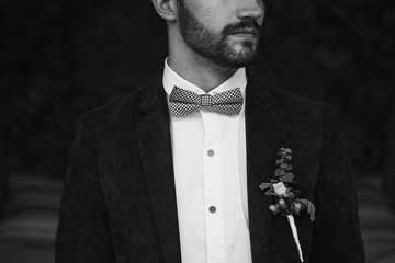 Stylish groom getting prepared for wedding