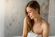 © Alexandr - beautiful young woman in a towel sitting on a bath