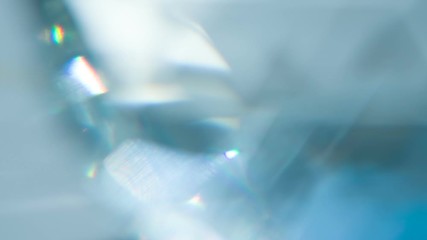 Wall Mural - Sparkling Diamond Glare. Loop. The light passes through the facets of a slowly rotating diamond and creates repetitive sparkling highlights and rainbow colors