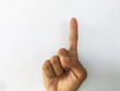 © tassita - hands counting number 1 or raised index finger on white background