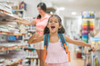 © FotoAndalucia - Mother and daughter buying school supplies preparing to go back to school