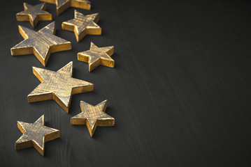 Wall Mural - Golden Christmas Stars  Rustic on a dark background, Copyspace, handmade
