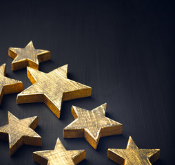 Wall Mural - Golden Christmas Stars  Rustic on a dark background, Copyspace, handmade