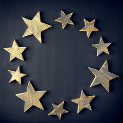 Wall Mural - Golden Christmas Stars  Rustic on a dark background, Copyspace,Round Frame, All around,handmade