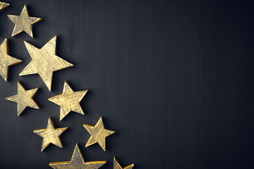Wall Mural - Golden Christmas Stars  Rustic on a dark background, Copyspace, handmade