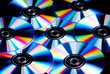 © Rob Wilkinson - a collection of cd, dvd disks with rainbow colour reflections