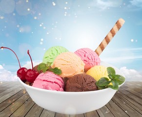 Poster - Ice cream scoops in bowl with wafer on white background