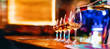 Wine serving in glasses in night club bar restaurant | Blurred background