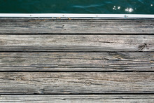 Top View Of Wooden Dock With Water