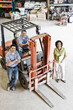 © Mint Images - Portrait of workers and manager standing in workshop