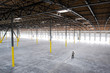 © Mint Images - Owner checking out interior of empty warehouse space