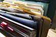 © Mint Images - Close up of files and file folders on desk