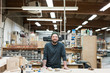 © Mint Images - Portrait of smiling carpenter standing in workshop