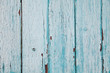 Texture of old blue paint on a wooden fence. Background for your design.