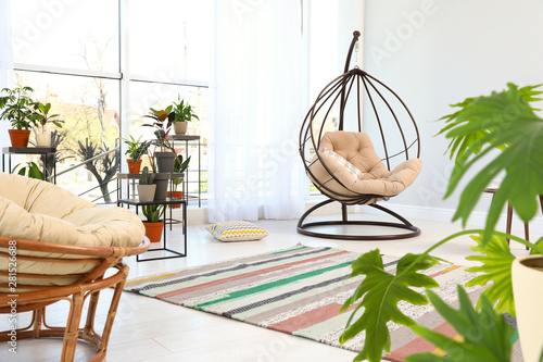 Living Room Interior With Swing Chair And Indoor Plants