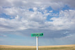 © Mint Images - Rural hospital sign against cloudy sky