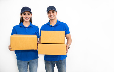 Wall Mural - Portrait of happy delivery couple man woman with cardboard box and clipboard isolated on white background, Young asian team wearing blue uniform. Delivery teamwork concept