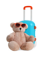 Composition With Stylish Little Blue Suitcase And Teddy Bear On White Background