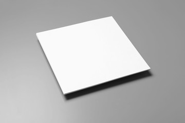 Blank paper sheets for brochure on grey background. Mock up