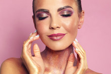 Sexy Young Woman With Glitter Makeup On Pink Background