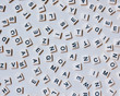 © Mint Images - Overhead view of blocks of scattered letters