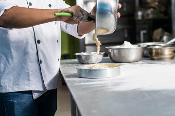 zoom of pastry chef with batter