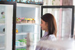 © SVRSLYIMAGES - woman choosing cake at bakery store