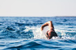 © astrosystem - Swimmer training on the open sea / ocean.