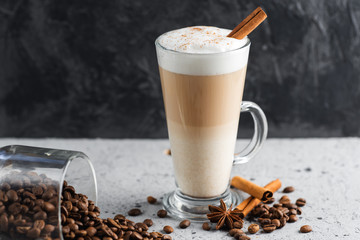 Coffee latte in a glass on a concrete table