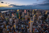 Fototapeta Miasta - New York City skyline with urban skyscrapers at sunset.