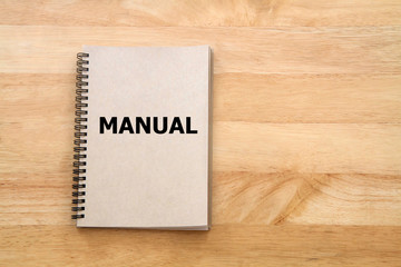 Wall Mural - User manual or Instruction manual book on wooden desk