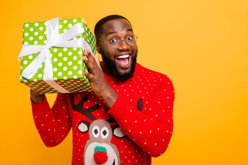 Canvas Print - Close-up portrait of his he nice attractive cheerful cheery glad funny funky guy having fun cool celebratory weekend vacation bow ribbon box isolated over bright vivid shine yellow background