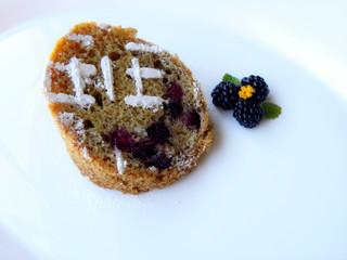 blackberry cupcake on a white background