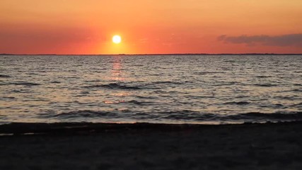 Wall Mural - sunset at the sea with clouds and yellow orange sky