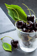 Black cherries in a clear glass, healthy food.
