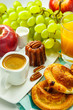 Continental breakfast with croissants, fruit and coffee