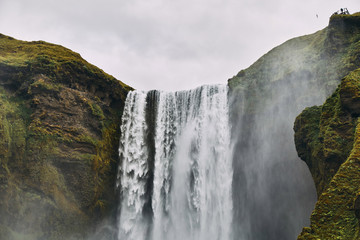 Wall Mural - Beautiful scenery of the majestic Skogafoss Waterfall in countryside of Iceland in summer. 