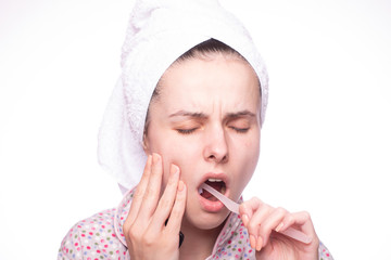 beautiful young woman brushing her teeth, pain