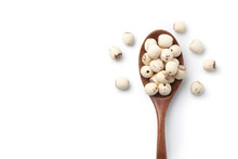 Dried Lotus Seeds In A Wooden Spoon Isolated On White Background. Top View.
