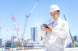© taka - asian engineer worker working in construction site