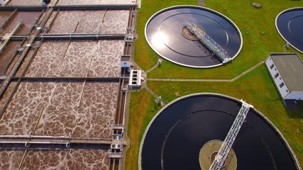 Wall Mural - Aerial view to sewage treatment plant. Grey water recycling. Waste management theme. Ecology and environment in European Union.