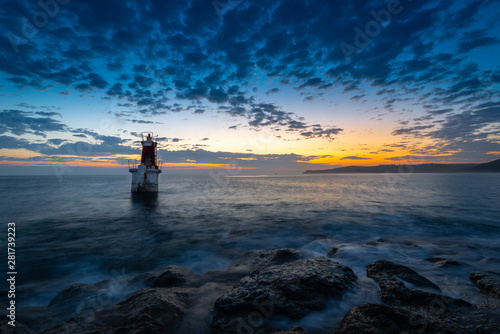 Fotomural Lighthouse at the entrance of San Vicente de la Barquera harbor, Cantabria, Spai