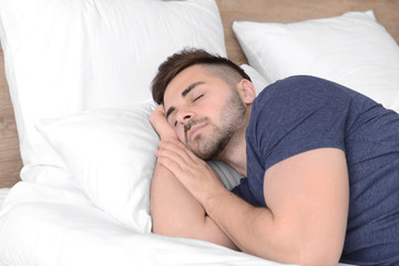 Canvas Print - Handsome man sleeping in bed at home