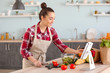 © Pixel-Shot - Beautiful woman preparing tasty vegetable salad in kitchen at home