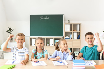 Wall Mural - Pupils after successful passing of school test in classroom