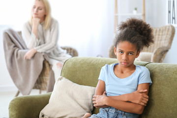 Canvas Print - Offended African-American girl after quarrel with mother at home