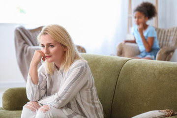 Canvas Print - Sad woman after quarrel with daughter at home