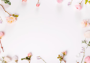 Festive flower composition on the white wooden background. Overhead view