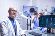 © DC Studio - Portrait of senior scientist man looking at the camera in a science laboratory