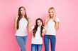 © deagreez - Portrait of three nice shine attractive lovely glad cheerful cheery crazy playful comic cool girls having fun showing horns symbol sign maternity isolated over pink background